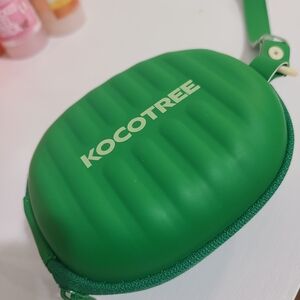 Kocotree Green Crossbody Bag with Kids glasses.